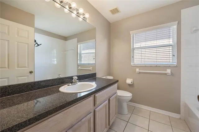 an empty room with a fan