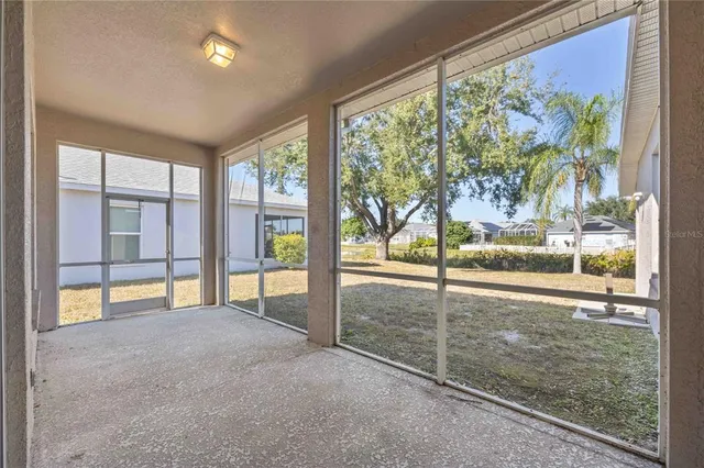 a view of a lake with houses in the back