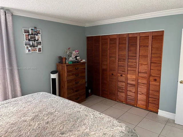 a bedroom with a bed and a cabinets