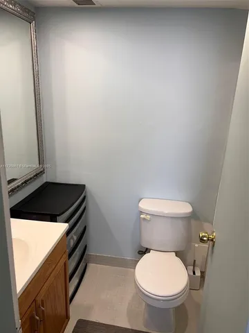 a bathroom with a toilet and a sink