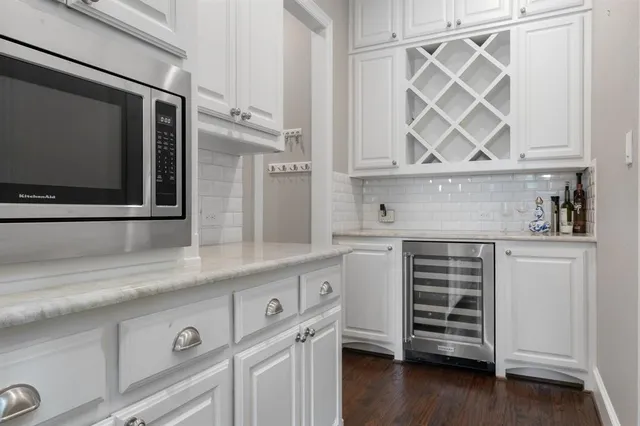 a kitchen with a sink and a microwave