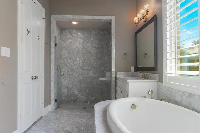 a bathroom with a bathtub and a sink