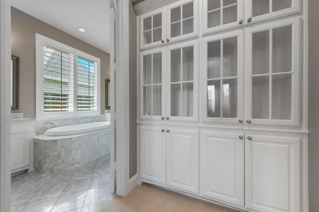 a view of walk in closet with white walls