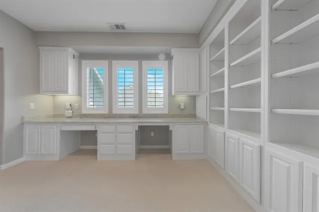 a room with cabinets and window