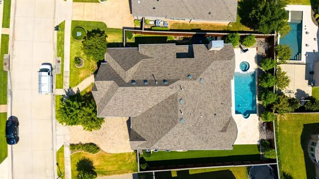 an aerial view of houses with outdoor space