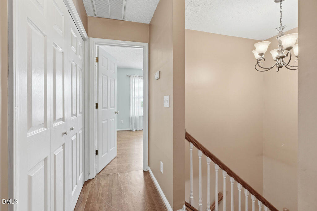 1560 Cane Mill Road Coats, NC 27521 - Photo 20 of 32 a view of a hallway with wooden floor
