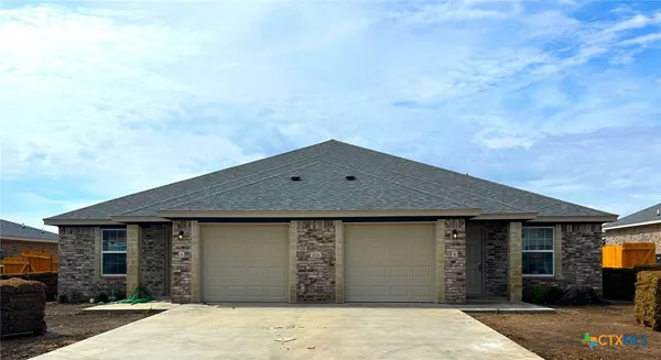a front view of a house with a garage