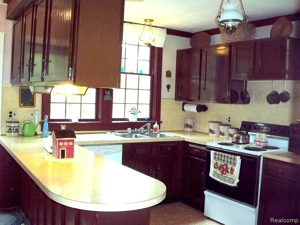 1480 Noble Road Leonard, MI 48367 - Photo 16 of 33 PLENTY OF COUNTER AND CABINET SPACE FOR ALL YOUR COOKING AND ENTERTAINING NEEDS