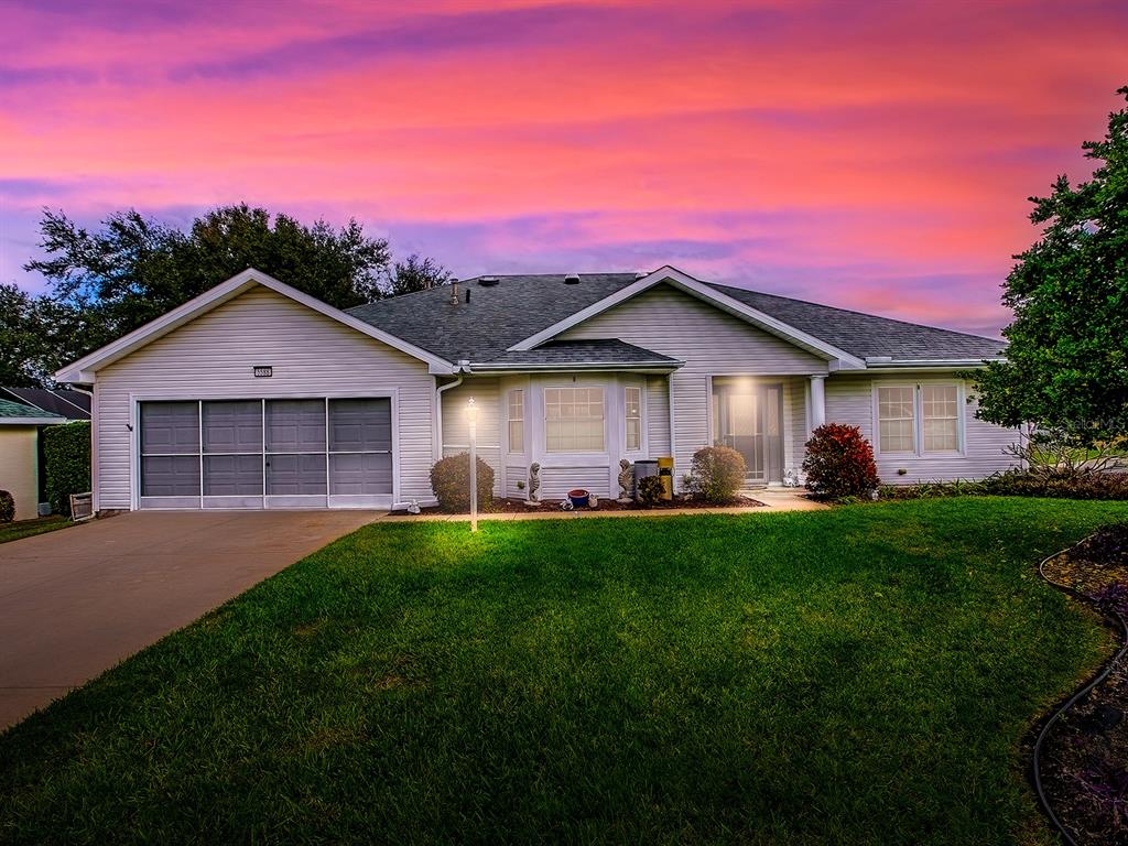 5588 Gulf Stream Street Tavares, FL 32778 - Photo 2 of 44 a front view of a house with a yard