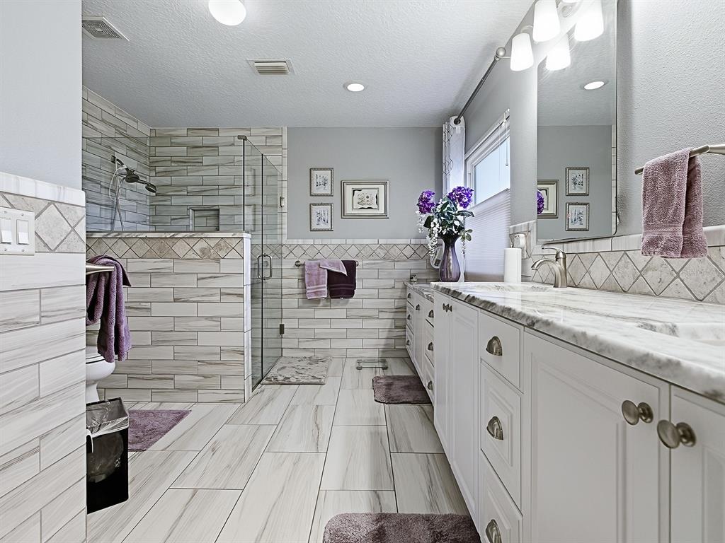 5588 Gulf Stream Street Tavares, FL 32778 - Photo 21 of 44 a bathroom with a sink and a mirror