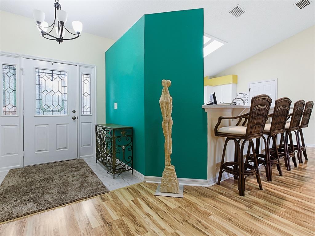 5588 Gulf Stream Street Tavares, FL 32778 - Photo 7 of 44 a view of a livingroom and dining room
