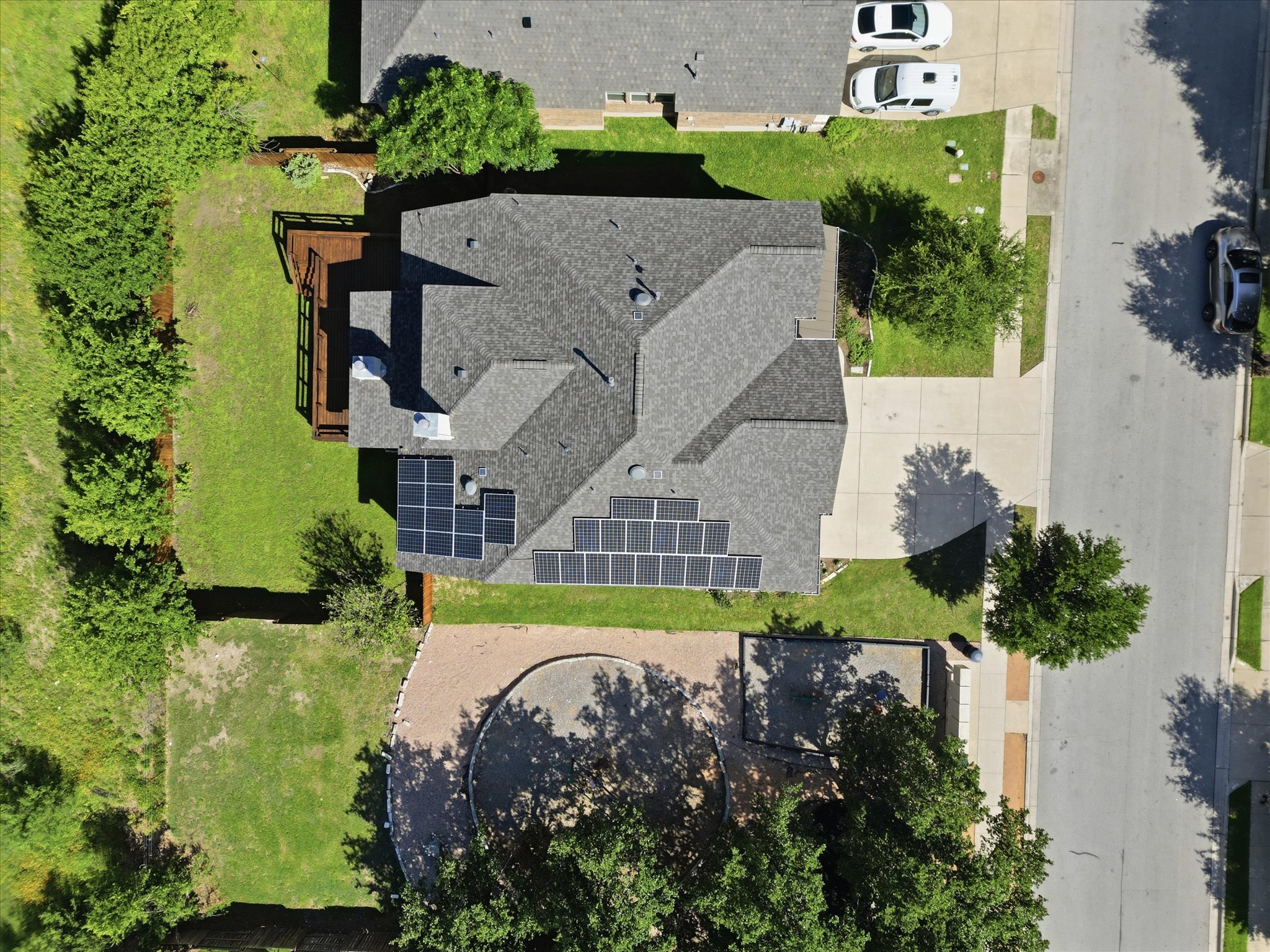 1511 Rimstone Drive Cedar Park, TX 78613 - Photo 31 of 39 An aerial perspective reveals new solar panels to save huge electricity bills for you. a residence with an attached deck and solar panels, nestled among verdant landscaping.