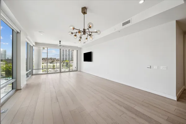 a spacious bathroom with a shower sink and mirror