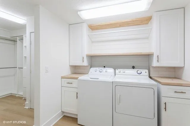 a utility room with dryer and washer