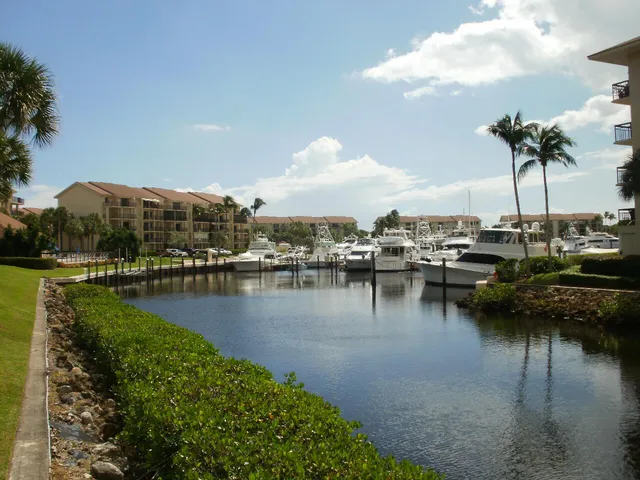 a view of beach and small yard