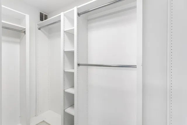 a view of a chairs and table in backyard