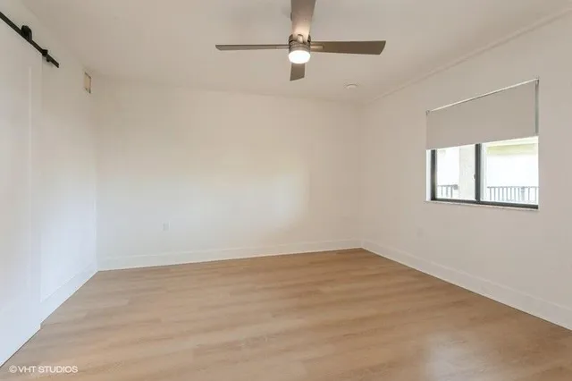 a view of an empty room with a window