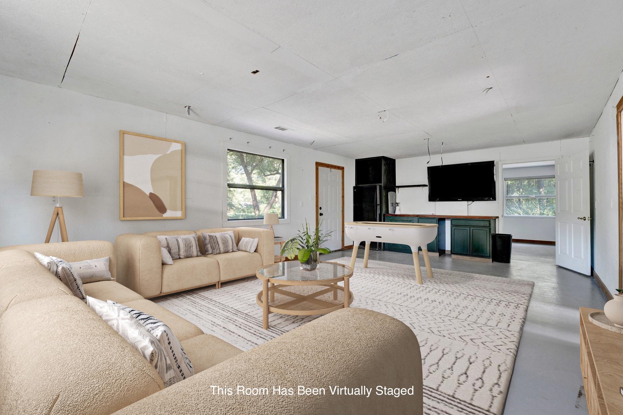 1300 Mullins Station Road Memphis, TN 38134 - Photo 21 of 34 Living room with concrete flooring and a healthy amount of sunlight