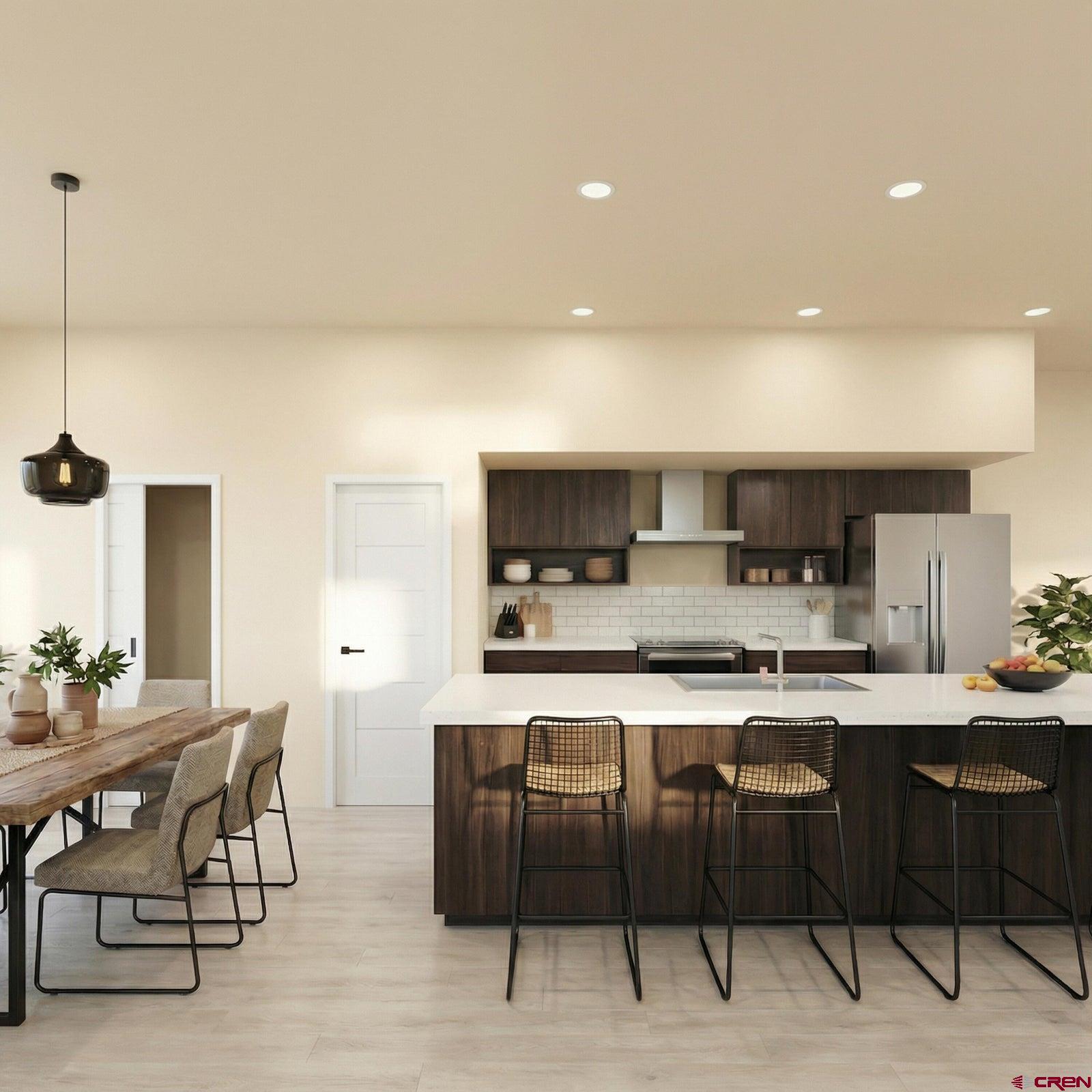 604 Charles Street Ridgway, CO 81432 - Photo 5 of 21 a kitchen with a table and chairs in it