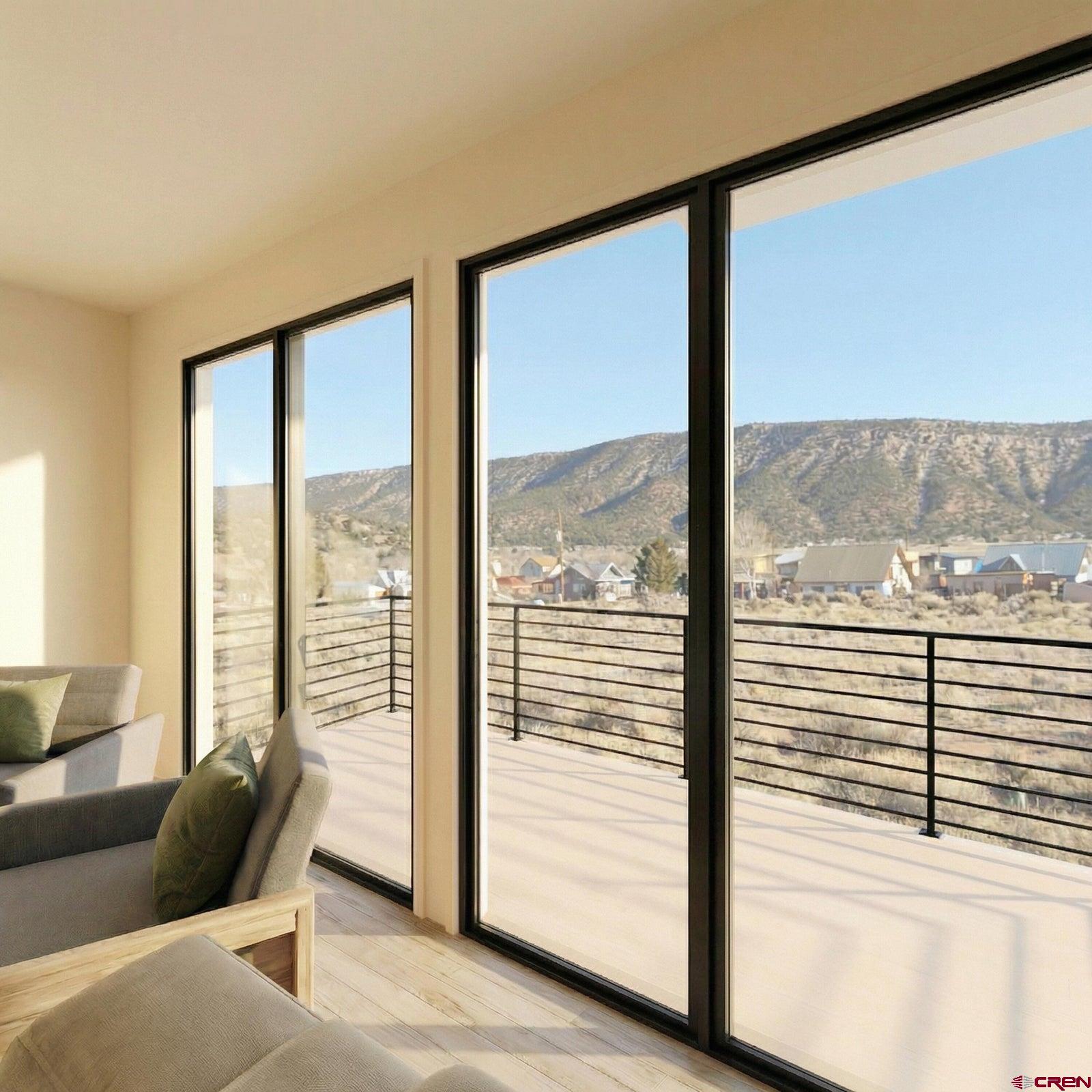 604 Charles Street Ridgway, CO 81432 - Photo 7 of 21 a view of a living room filled with furniture and a window