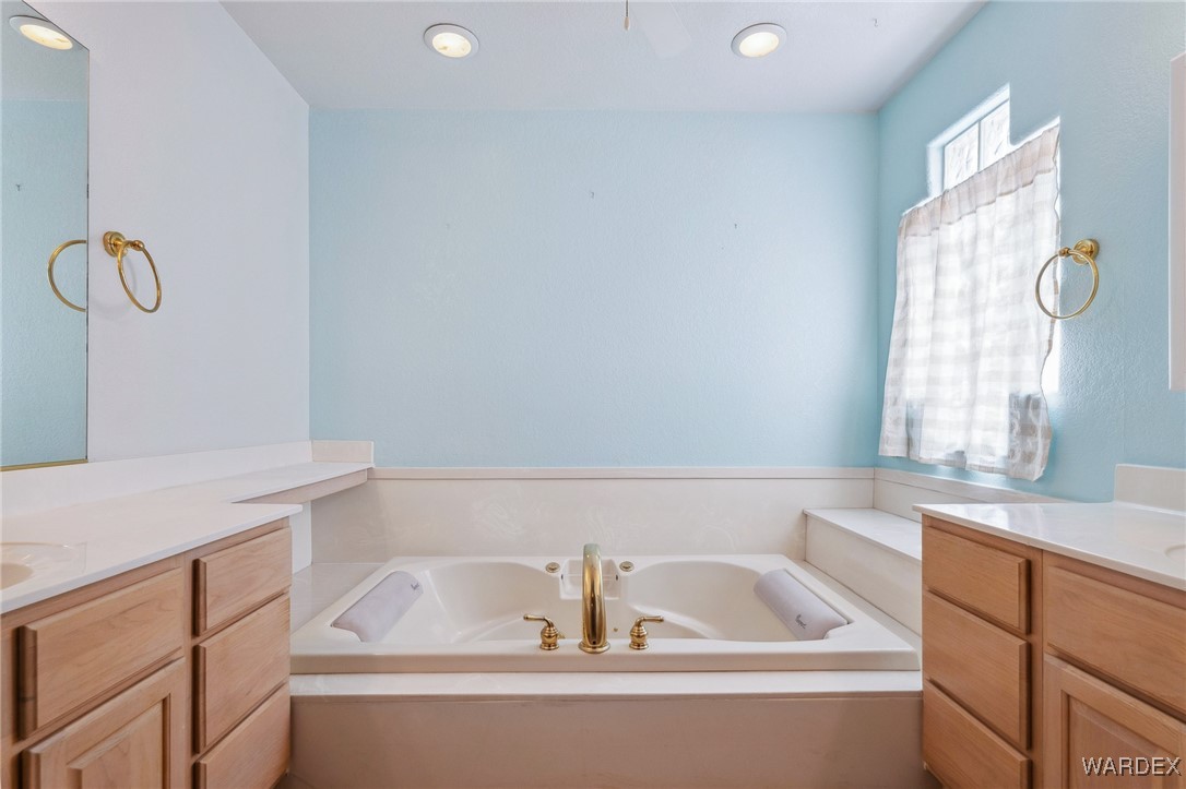 5967 Mountain View Road Fort Mohave, AZ 86426 - Photo 13 of 18 a bathroom with a bathtub and a sink