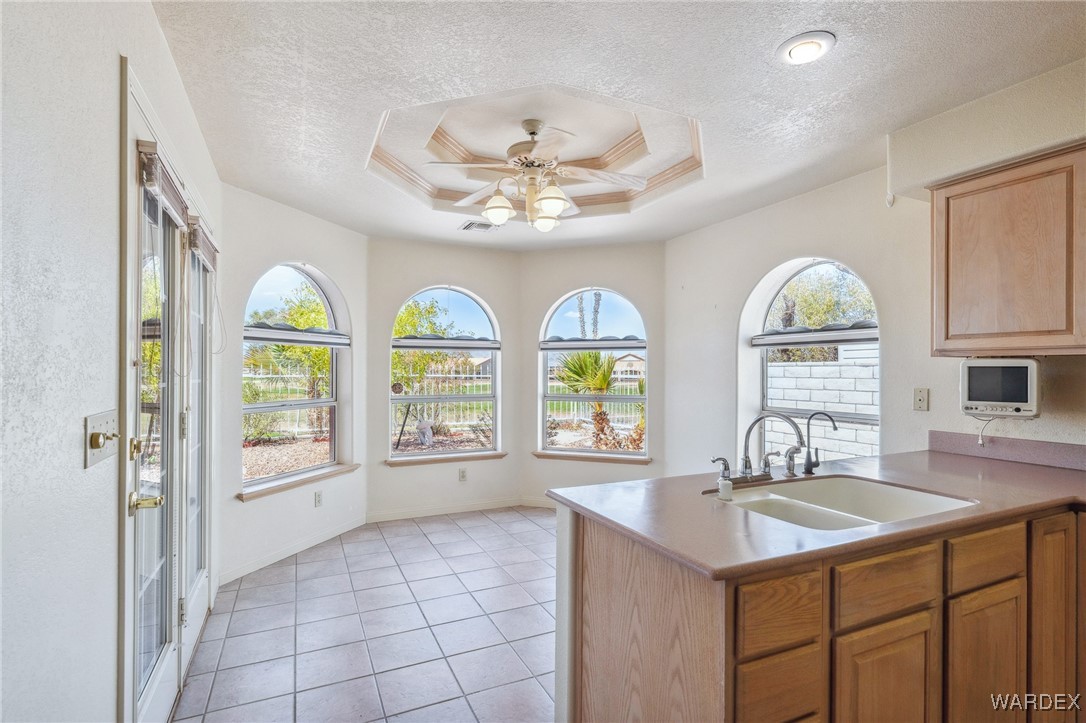 5967 Mountain View Road Fort Mohave, AZ 86426 - Photo 5 of 18 a view of a kitchen with granite countertop a sink stainless steel appliances and cabinets