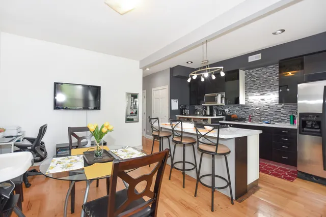 a kitchen with a sink stove and refrigerator