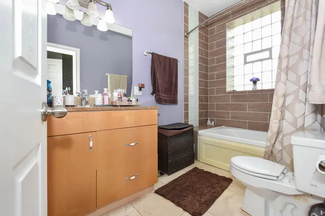 a bathroom with a sink a mirror and vanity