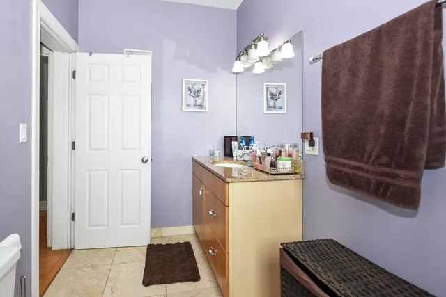 a view of a room with wooden floor and windows