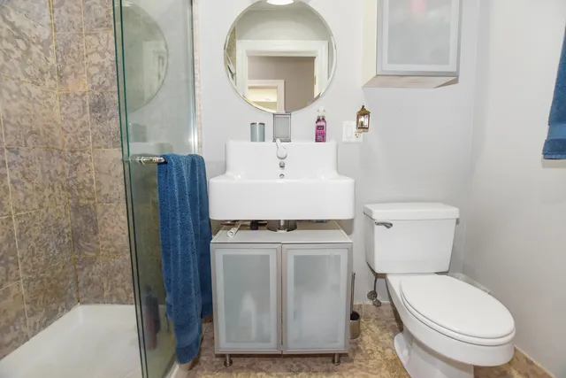 a living room with furniture a flat screen tv and a window