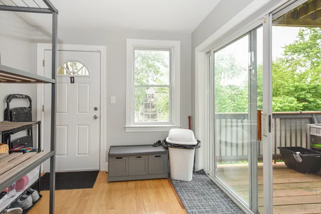 a view of balcony with wooden floor