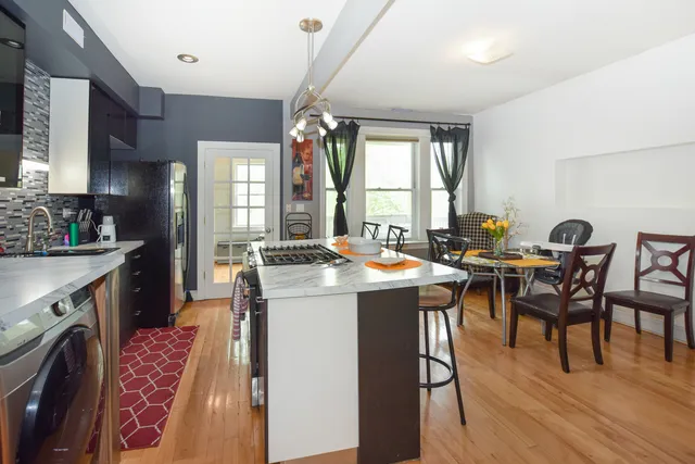 a open kitchen with a table and chairs in it