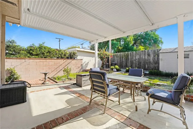 a view of swimming pool with outdoor seating yard