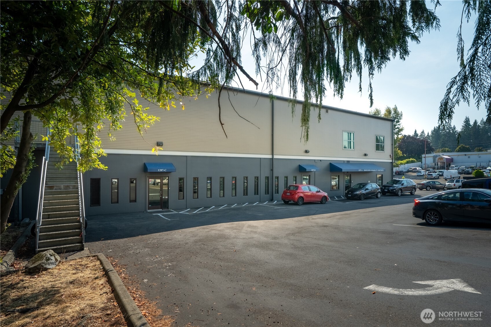 1207 North 152nd Street, Unit C Shoreline, WA 98133 - Photo 15 of 17 a view of a car parked in front of a building