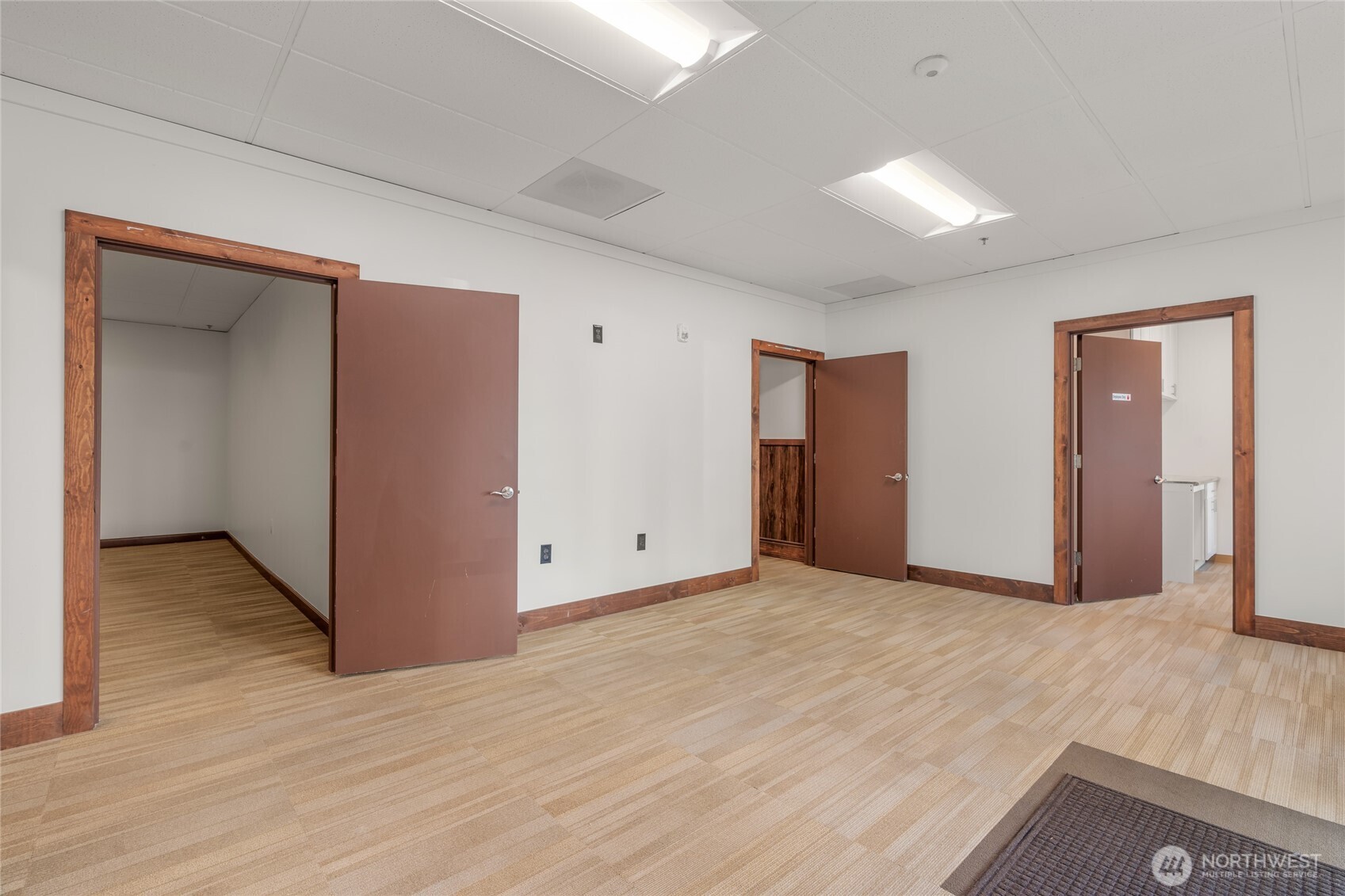 1207 North 152nd Street, Unit C Shoreline, WA 98133 - Photo 3 of 17 an empty room with wooden floor and closet