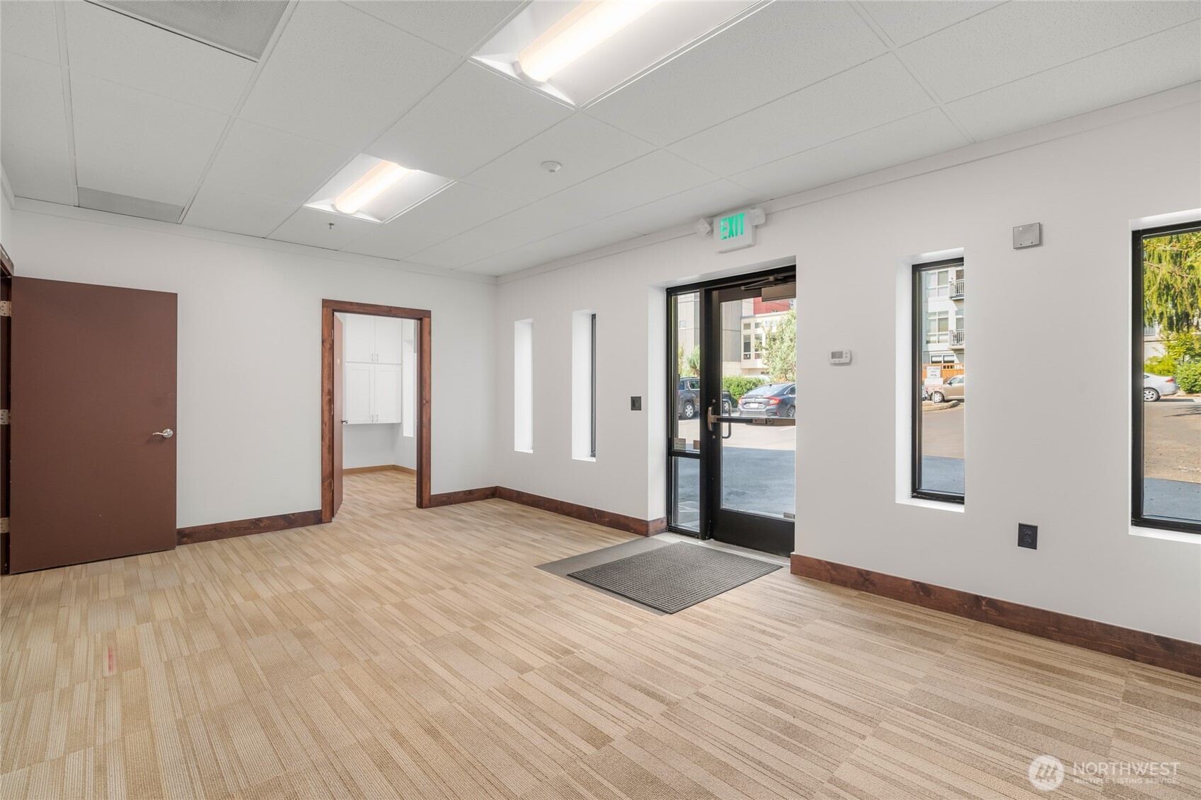1207 North 152nd Street, Unit C Shoreline, WA 98133 - Photo 4 of 17 a view of an empty room with wooden floor and a window