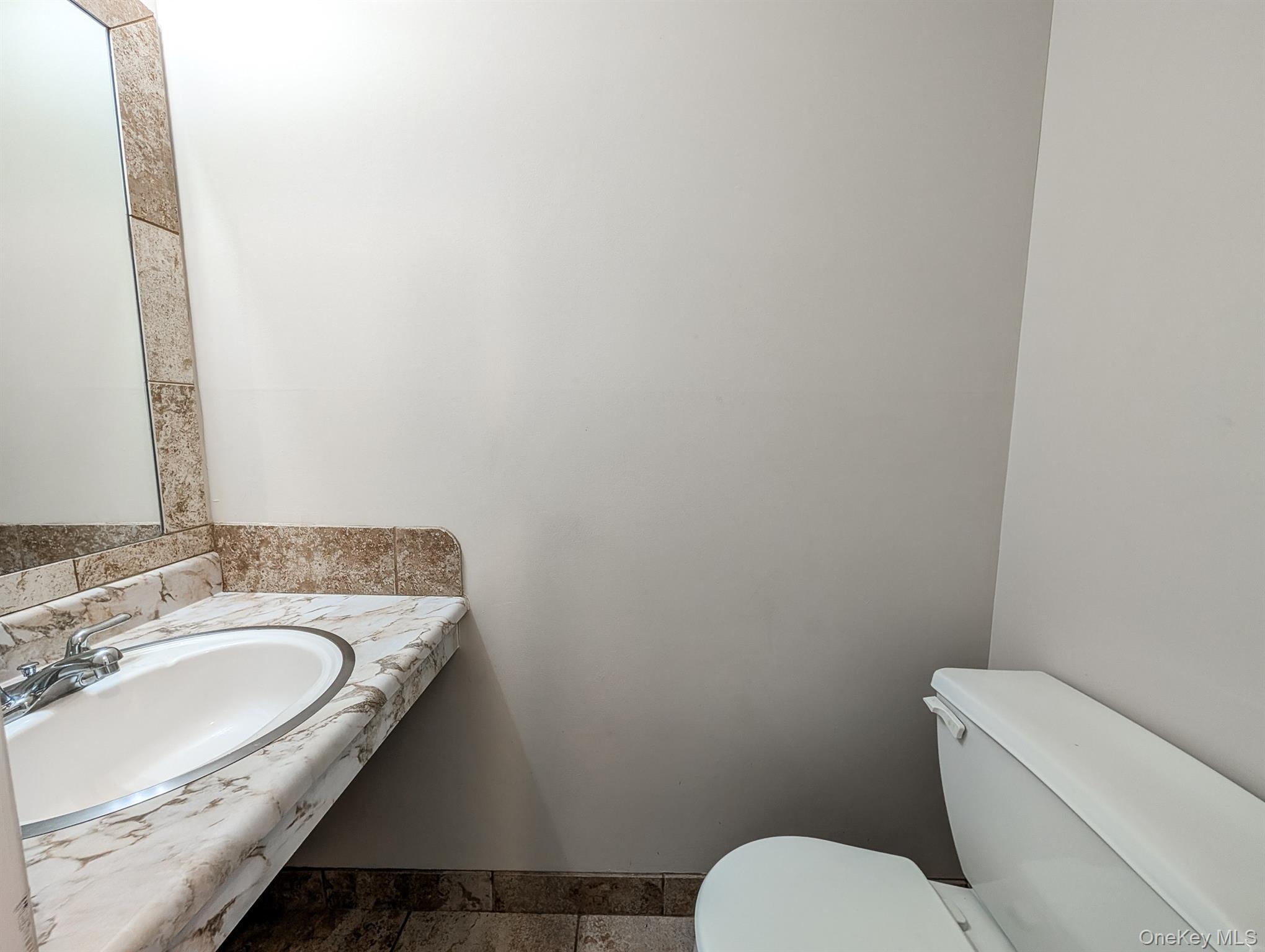 136 Hill Crescent Calverton, NY 11933 - Photo 10 of 21 Half bathroom featuring toilet and vanity