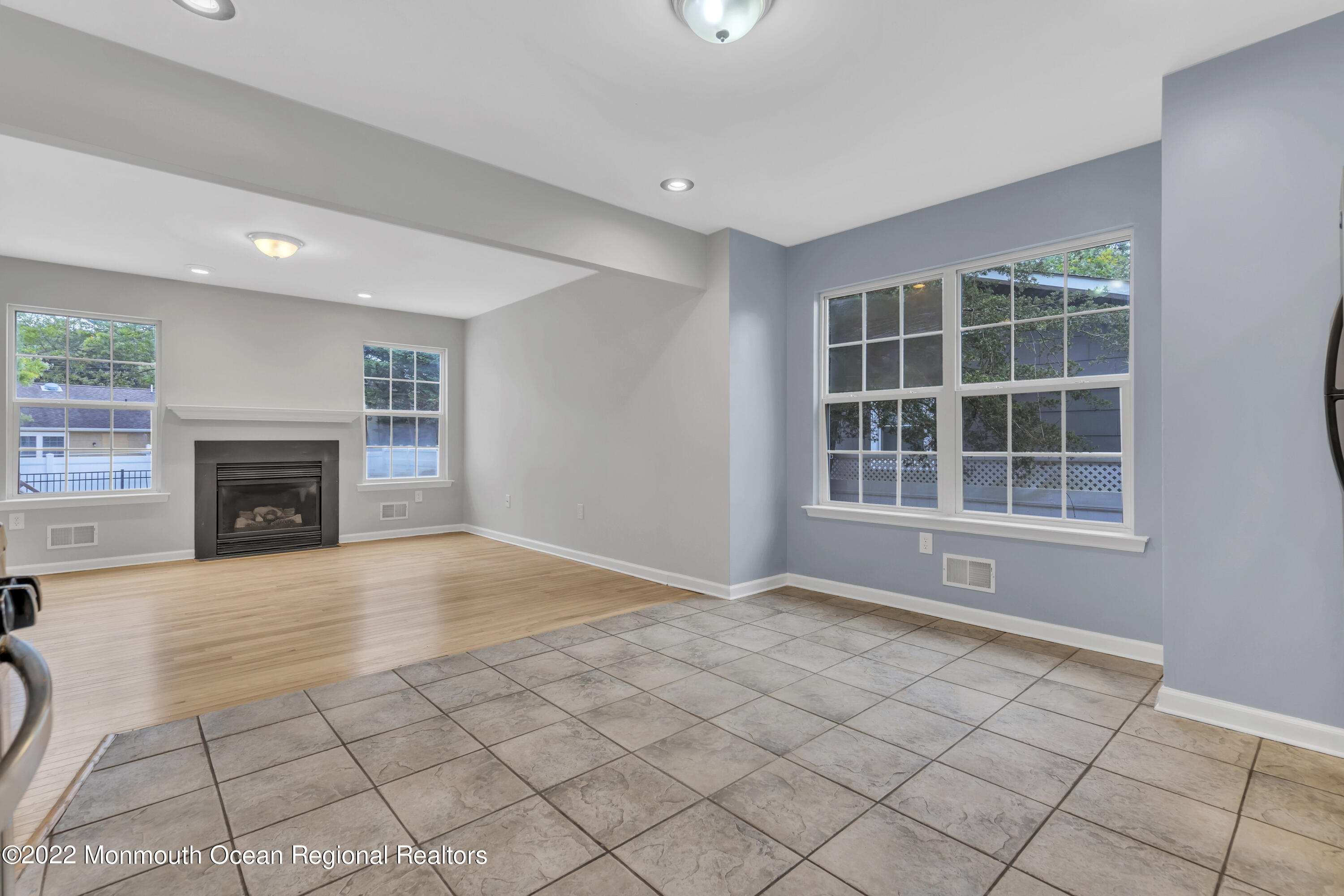145 Gunwale Road Manahawkin, NJ 08050 - Photo 19 of 44 a view of an empty room with a fireplace and a window