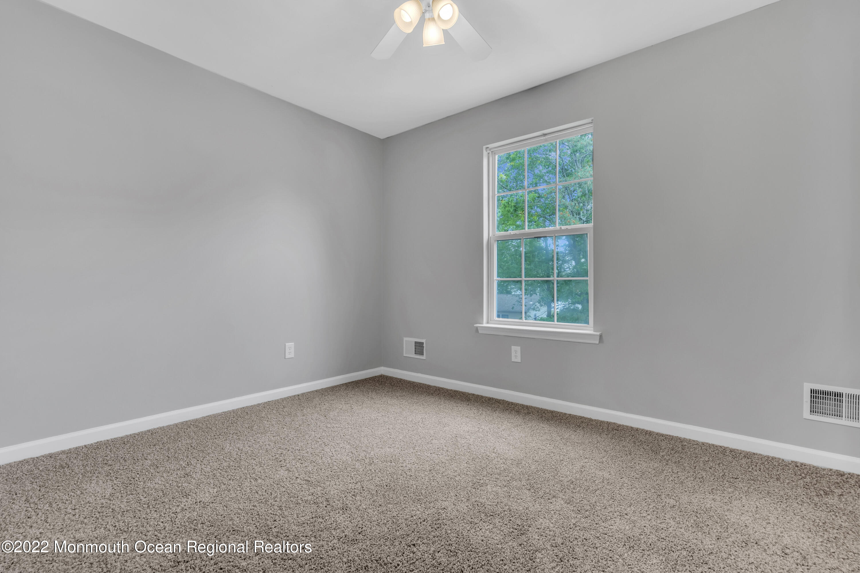 145 Gunwale Road Manahawkin, NJ 08050 - Photo 29 of 44 a view of an empty room with a window