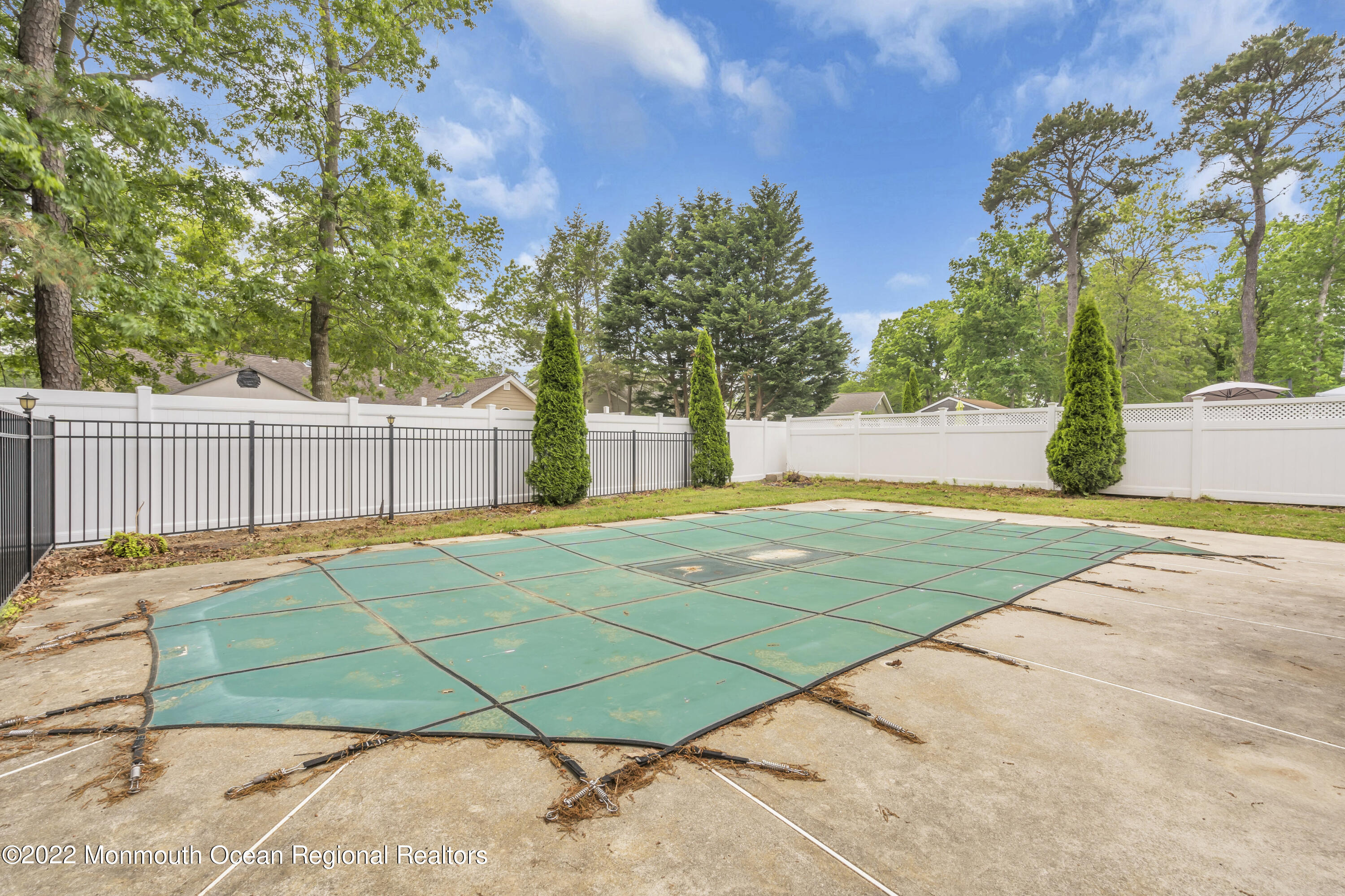 145 Gunwale Road Manahawkin, NJ 08050 - Photo 36 of 44 a view of a yard with a house