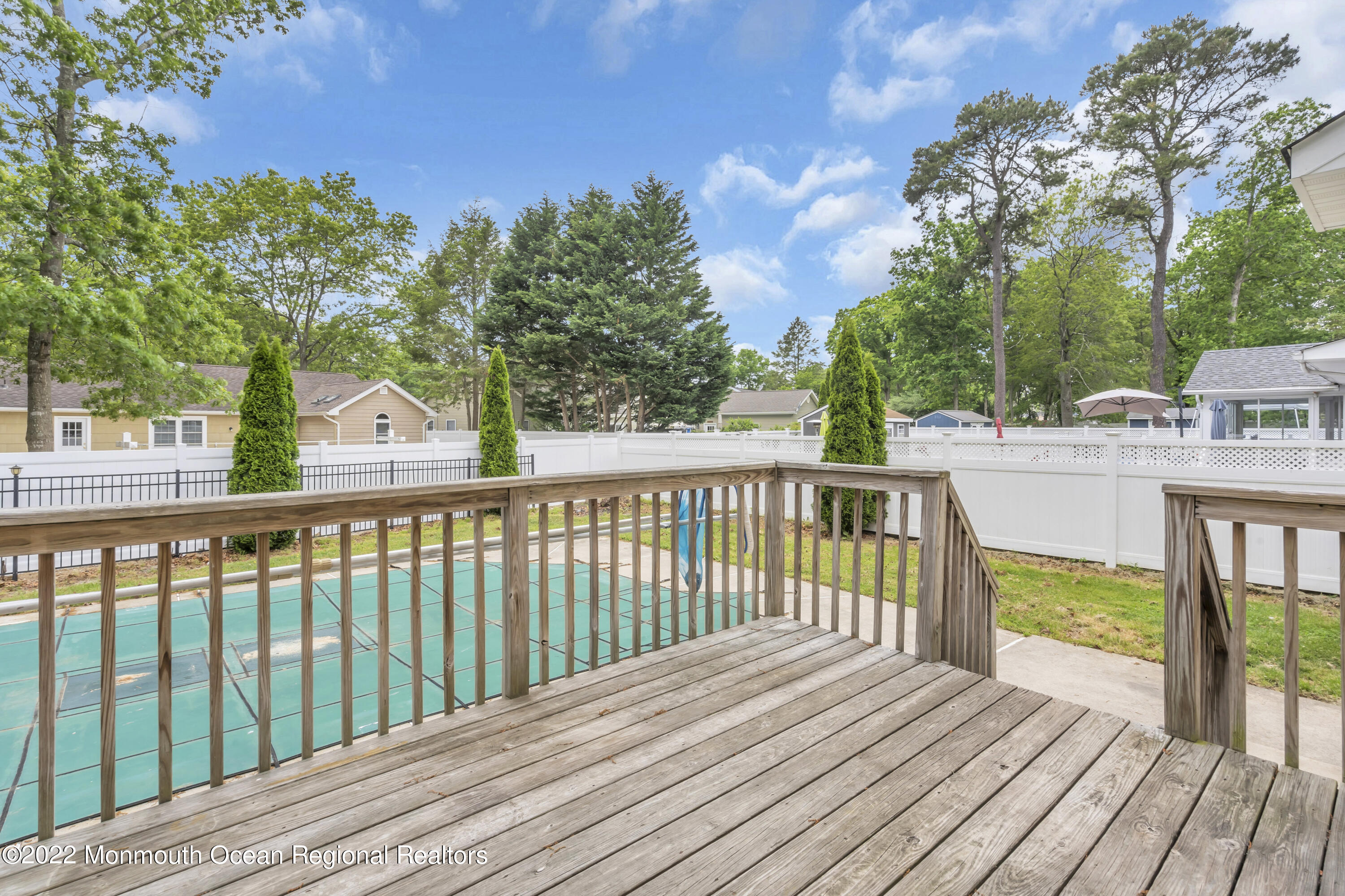 145 Gunwale Road Manahawkin, NJ 08050 - Photo 41 of 44 a view of balcony with wooden floor and fence