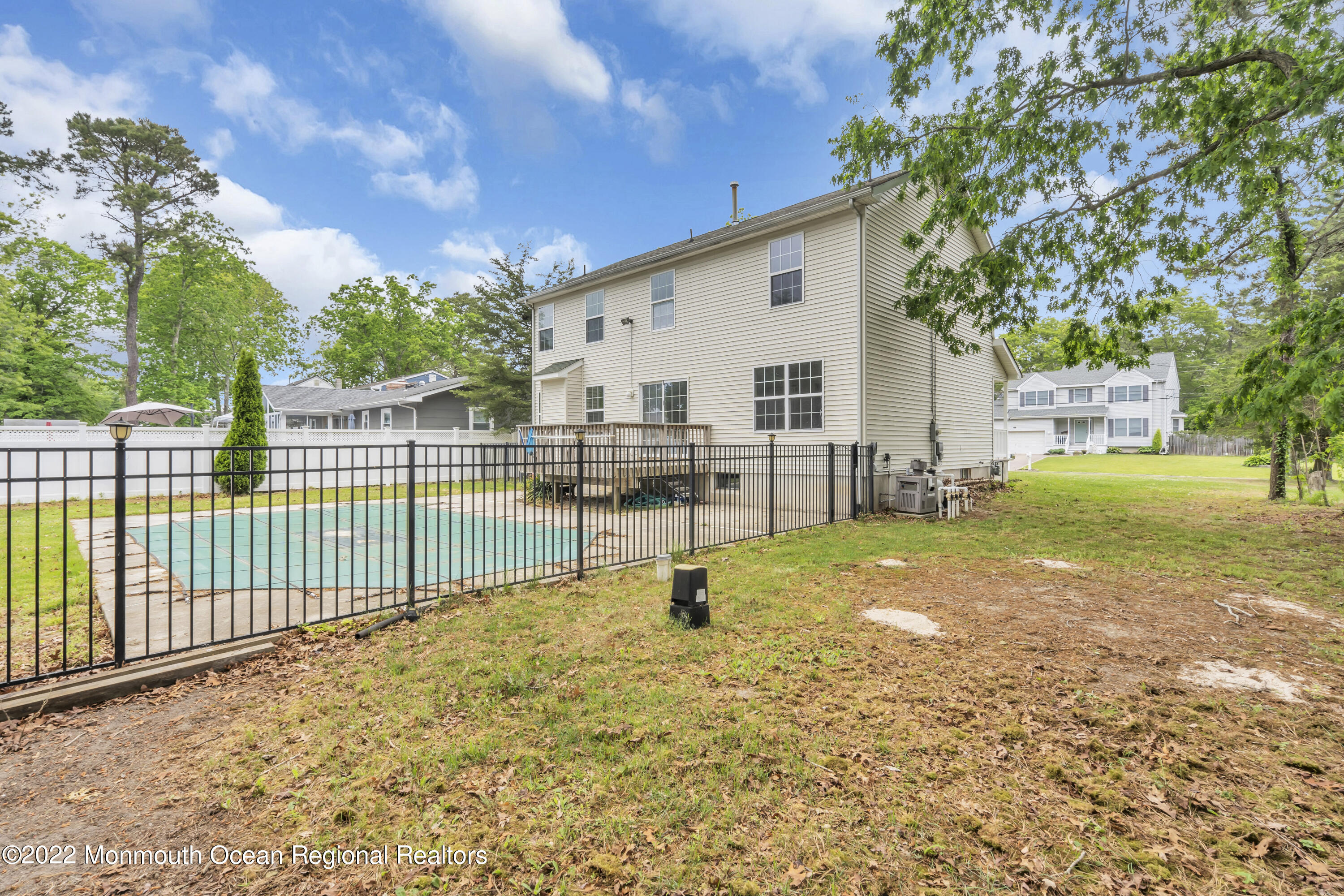 145 Gunwale Road Manahawkin, NJ 08050 - Photo 44 of 44 a view of a backyard with a large tree