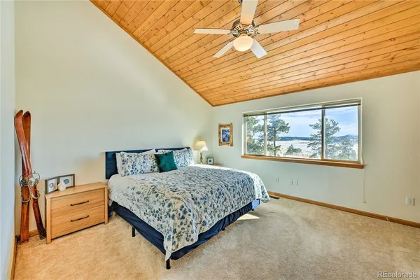 a room with furniture pool table and flat screen tv