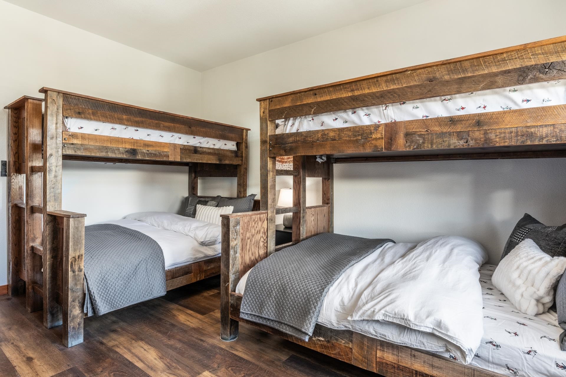 6201 Minaret Road, Unit 2430 Mammoth Lakes, CA 93546 - Photo 37 of 54 Bedroom featuring wood-finish flooring, a wood-frame bed, two wood nightstands with integrated drawe