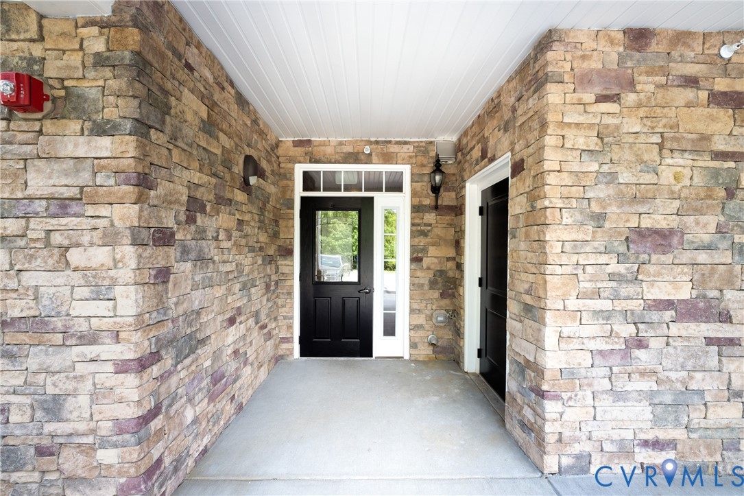 1111 Briars Court, Unit 303 Midlothian, VA 23114 - Photo 2 of 41 a view of entryway with a brick wall