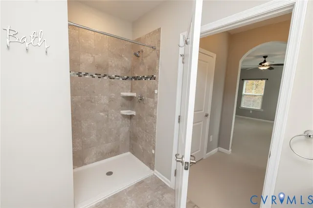 a bathroom with a shower and a toilet