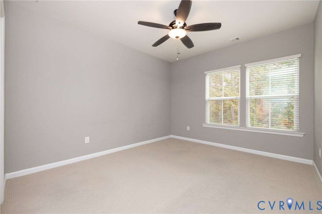 1111 Briars Court, Unit 303 Midlothian, VA 23114 - Photo 24 of 41 an empty room with a window and a fan