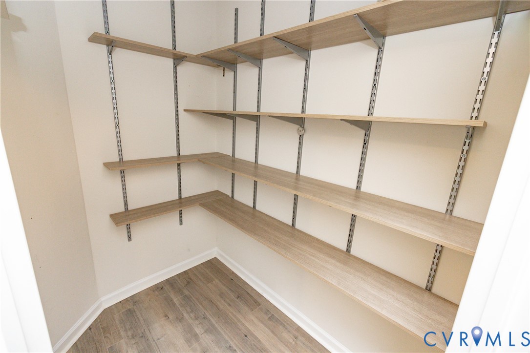 1111 Briars Court, Unit 303 Midlothian, VA 23114 - Photo 25 of 41 a view of walk in closet with empty racks
