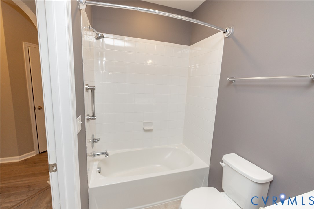 1111 Briars Court, Unit 303 Midlothian, VA 23114 - Photo 27 of 41 a bathroom with a toilet and a bathtub