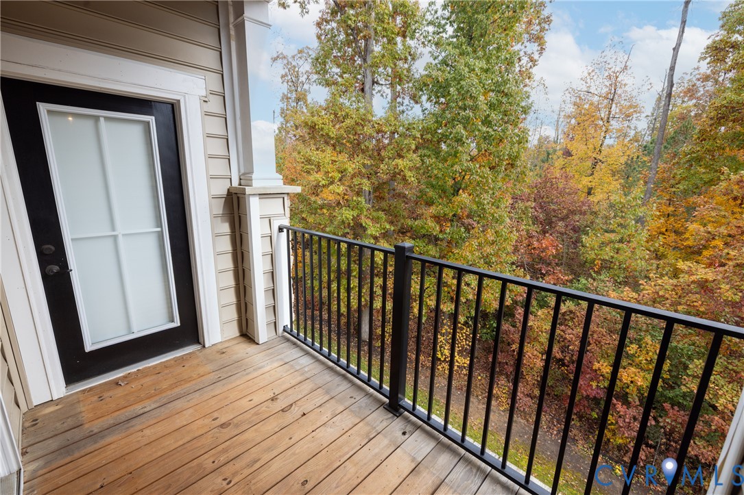 1111 Briars Court, Unit 303 Midlothian, VA 23114 - Photo 28 of 41 a view of a balcony with wooden floor
